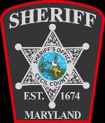 Cecil County Maryland Sherriff’s Office Badge. Words in White on top and bottom outside of the star, with Black lettering in the middle of the white star badge. Established in 1674.